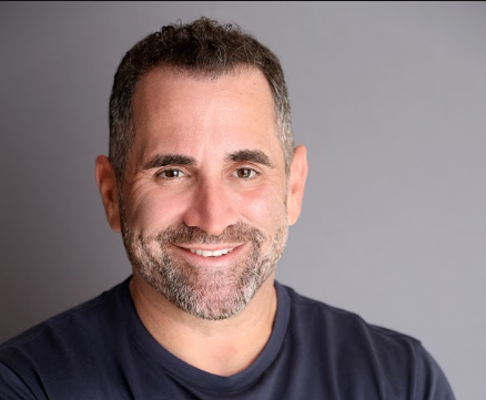 Smiling man with short beard